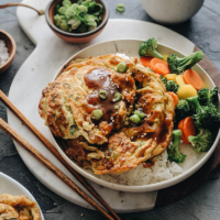 Easy Egg Foo Young - Crispy fluffy egg foo young filled with crisp veggies and aromatic green onion and served with a rich brown sauce. It’s super easy to make and tastes so satisfying. Serve it with steamed rice and veggies and you’ll have a nutritious meal in no time.