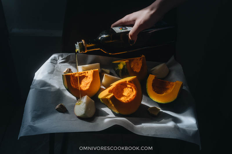 Drizzle olive oil on kabocha squash