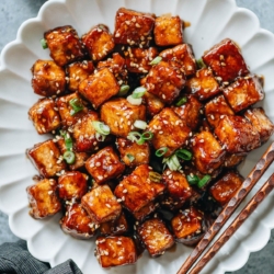 Sesame tofu is a quick and delicious main dish with crispy tofu covered in a sticky, sweet, and savory sauce. Try out this recipe to enjoy tofu with a bold flavor. {Vegan, Gluten-Free Adaptable}