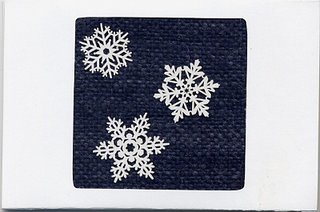 White card with handspun, handwoven navy blue inset & snowflake stickers.