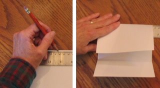 Marking the card to fold in thirds.