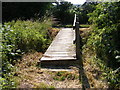 TM3570 : Footbridge on the footpath to The Mounts by Geographer