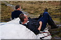 SE0704 : Taking a rest on path-making materials on the top of Black Hill by Bill Boaden