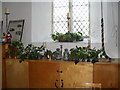 SZ8196 : Christmas decorations within Earnley Church by Basher Eyre