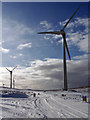 NG3547 : Wind farm, main road by Richard Dorrell