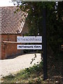 TG0528 : Nethergate House & Nethergate Farm Sign by Geographer