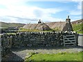 NB1944 : Gearrannan - Two blackhouses behind a wall by Rob Farrow