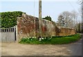 TQ4214 : Brick wall and daffodils, Barcombe by nick macneill