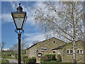 SE0753 : Ornate lamp and village hall by Pauline E