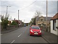 NU0139 : Looking east down Main Street, Lowick by Graham Robson