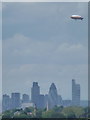 TQ4274 : Eltham: view of the Goodyear blimp over the City buildings by Chris Downer