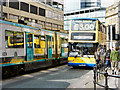 SJ8498 : Tram and Bus on High Street by David Dixon