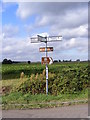 TM3384 : Roadsign at Wash Lane junction by Geographer