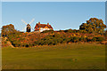 TQ2349 : Reigate Heath Windmill and Reigate Heath Golf Club clubhouse by Ian Capper