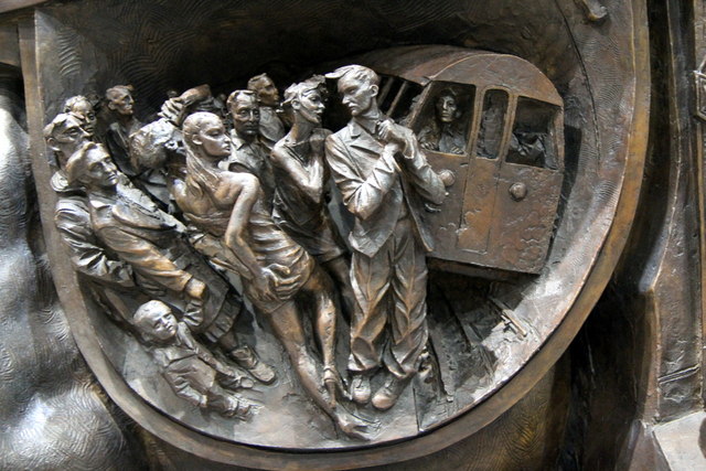 Frieze on statue, The Meeting Place, St Pancras Station, London N1