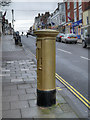 SZ3295 : Lymington High Street, Ben Ainslie's Golden Postbox by David Dixon