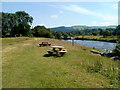 SN7027 : Picnic benches near an Afon Sawdde weir by Jaggery