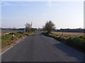 TM5399 : Entering Corton on Coast Road by Geographer