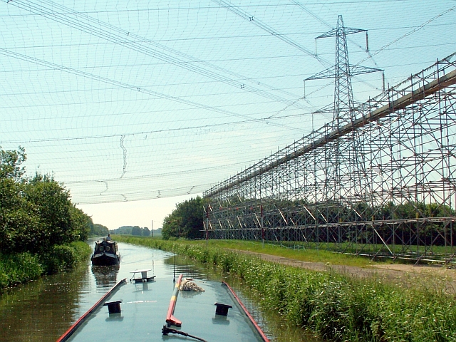 Safety scaffolding beneath power lines crossing the Well Creek