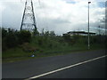 SJ9908 : Power lines cross M6 Toll at on slip by Colin Pyle