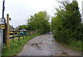 TM1338 : Bridleway to the A137 & entrance to Hill House & White House Cottages by Geographer