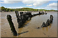 NX6548 : A shipwreck in Nun Mill Bay by Walter Baxter