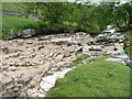 SD8880 : Dry waterfall on the River Wharfe by Christine Johnstone