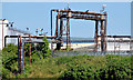 J3675 : Gantry and pipes, Belfast harbour by Albert Bridge