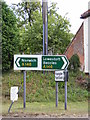 TG2803 : Roadsigns on the A146 Loddon Road by Geographer