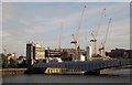 TQ2575 : Cranes at Wandsworth Bridge by Derek Harper