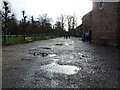 SJ7387 : Dunham Massey - puddles by Chris Allen