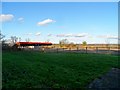 TL1801 : Large barn and farmland to rear of St Botolph's church by Bikeboy