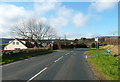 NZ9405 : Bus stops on the B1447 by Humphrey Bolton