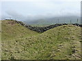 SH5703 : Earthworks - Tal-y-garreg hillfort by Richard Law