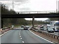 NS7892 : Polmaise Road Bridge over Southbound M9 by David Dixon