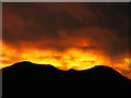 SH7677 : Sunset over Conwy mountain by Steve  Fareham