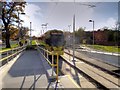 SJ8387 : Tram Leaving Benchill Metrolink Stop by David Dixon