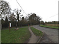 TL3758 : Main Street & Hardwick Village sign by Geographer