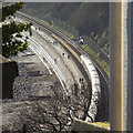 SX9574 : A glimpse of the railway and the sea wall promenade below Holcombe by Robin Stott