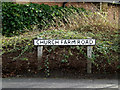 TM4557 : Church Farm Road sign by Geographer