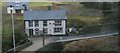 SH8403 : Houses at the bridge at Commins Coch, from the railway by Christopher Hilton