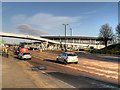 SJ8798 : Ashton New Road, Footbridge and Academy Stadium by David Dixon