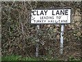 TM0667 : Clay Lane sign by Geographer