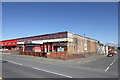 SH9980 : Derelict building on Rhyl seafront by Jeff Buck