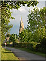 TF1406 : View along Main Road towards Etton church by Paul Bryan