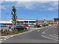 TA0388 : Sainsbury's and a windmill, Scarborough by John S Turner