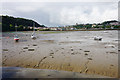 SH5972 : Exposed mud flats by Porth Penrhyn by Bill Boaden