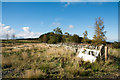 NY9954 : Dry stone wall with leaning gate by Trevor Littlewood