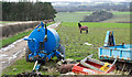 NZ2536 : Farm machinery beside farm road by Trevor Littlewood