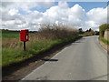 TM1552 : Bell's Cross Road & Cross Keys Postbox by Geographer